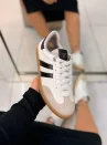 tênis casual feminino via marte branco com detalhes em preto e solado caramelo